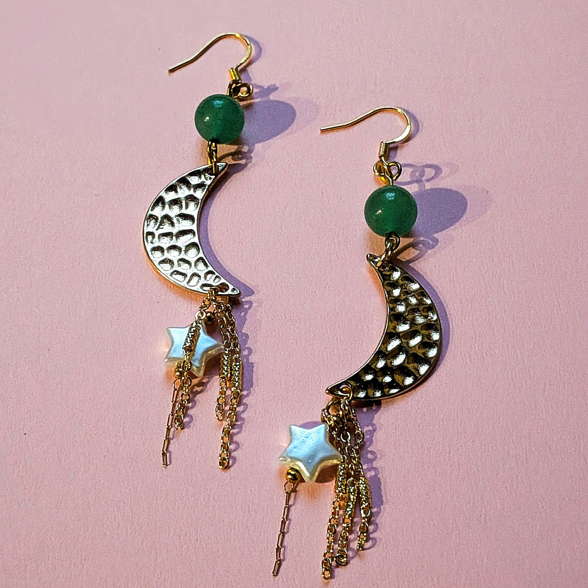UniquelyYou gold-tone celestial drop earrings with textured crescent moons, green beads, star charms, and tassels.