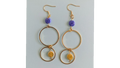 UniquelyYou gold-tone double hoop earrings with blue and yellow swirled beads.