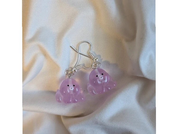 UniquelyYou pink translucent resin flower earrings with black eyes and white center, whimsical and cute design.