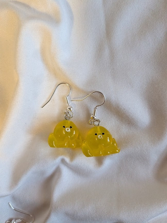 UniquelyYou yellow translucent resin chick earrings with black eyes and white beaks.